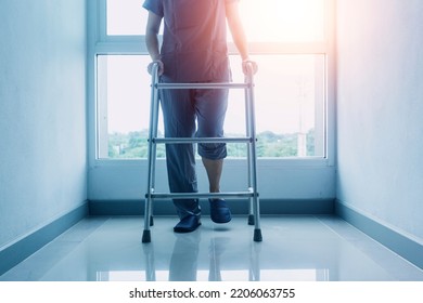 young asian physical therapist working with senior woman on walking with a walker - Shutterstock ID 2206063755