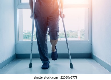 young asian physical therapist working with senior woman on walking with a walker - Shutterstock ID 2206063779