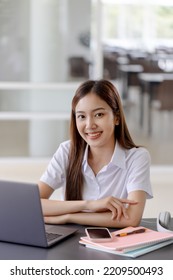 Young Asian Pretty Woman Using Laptop At Co Working Space.