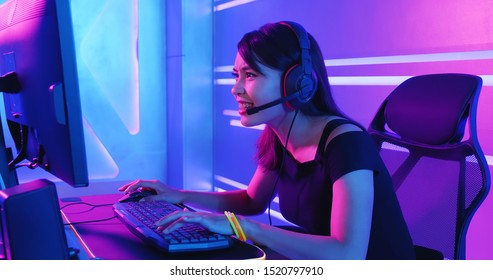 Young Asian Pro Gamer Girl Playing In Online Video Game