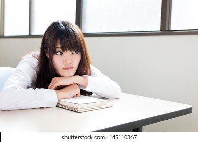 Young Asian Schoolgirl Studying