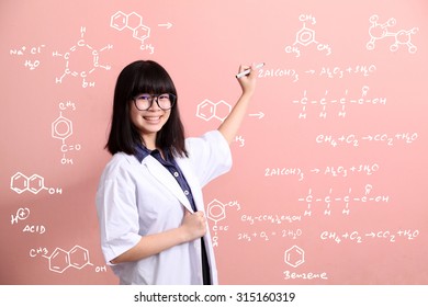 Young Asian Scientist Writing On Pink Wall Smile