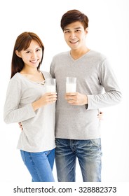 Young Asian Smiling Couple Drinking Milk