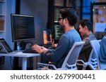 young Asian software development manager leads a late-night office discussion with his executive team, mentoring developers and analyzing source code to guide programming and project development