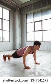 Young Asian Sport Man Push Up In The Gym