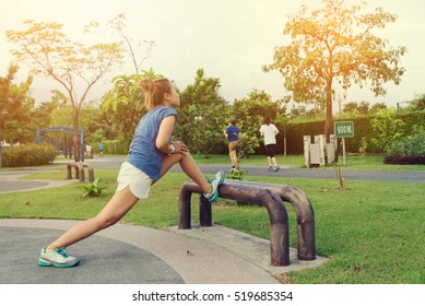 Young Asian Sport Woman Exercise in Outdoor Public Park Background - Lifestyle Workout Concept