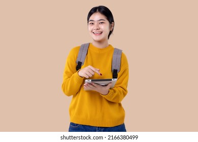 Young Asian Student Girl Using Tablet Computer On Isolated Background