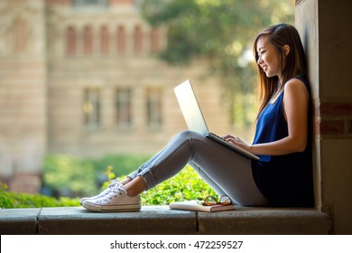 Young Asian Student On University Campus With Computer Laptop 