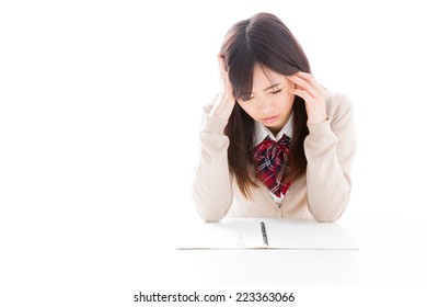 Young Asian Student Studying On White Background