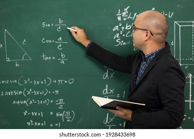 Young Asian Teacher Man Teaching Video Conference With Student. Male Indian Teacher Training The Mathematics In Classroom From Online Course.