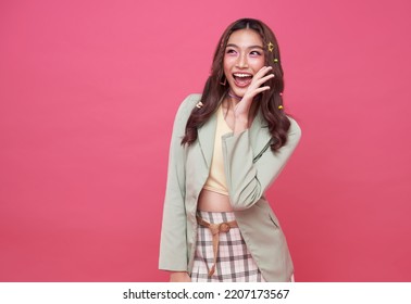 Young Asian teenage girl surprised excited isolated on pink background. - Shutterstock ID 2207173567