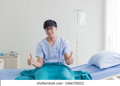 Young Asian Teenage Patient Showing Thumbs Up With Happy Smiley Face In The Hospital.