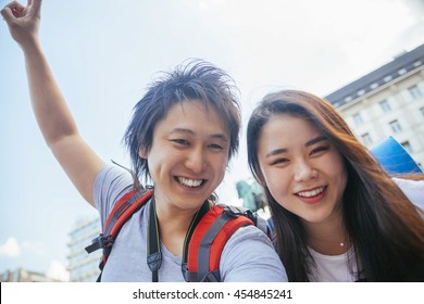 Young Asian Tourists Taking A Selfie