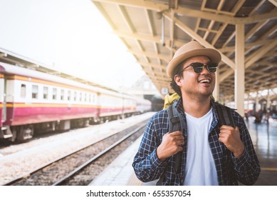 Young Asian Traveler Backpack In Train Station