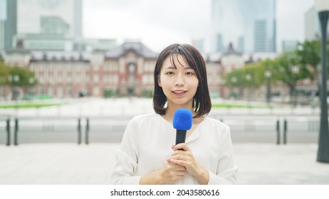 Young Asian TV Reporter In The Town.