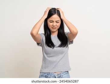 Young asian unwell unhealthy woman hand touching head she's feeling depressed stress headache be tired from working standing on isolated white background she has symptom office syndrome. - Powered by Shutterstock