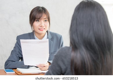 Young Asian Woman Arriving For A Job Interview. Business People Takling In Modern Office. Greeting Deal Concept