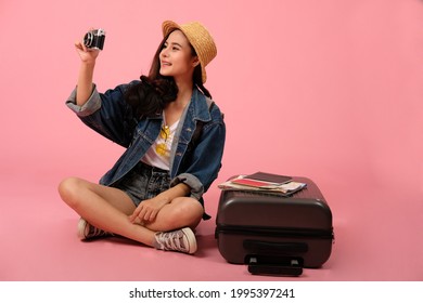 Young Asian Woman Backpacker Traveler With Camera. Journey Trip Travel. Studio Shot