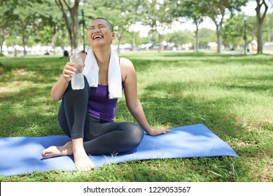 Young Asian Woman With Bald Head Enjoying Her Life After Surviving Cancer