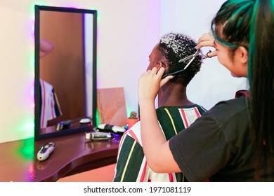 Young Asian Woman Barber  Cuting Black An White Hair Customer. Beautiful Hairstylist Trimming Scissors In Hair Cut Salon Shop.