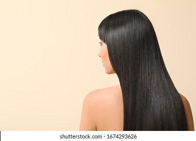 Young Asian Woman With Beautiful Long Hair On Color Background