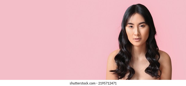 Young Asian Woman With Beautiful Long Wavy Hair On Pink Background With Space For Text