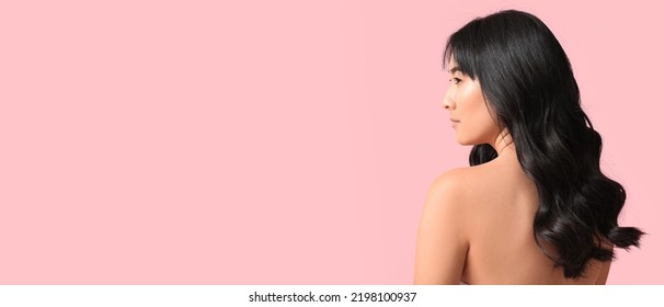 Young Asian Woman With Beautiful Long Wavy Hair On Pink Background With Space For Text