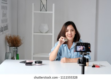 Young Asian Woman Beauty Blogger Showing How To Make Up Video Tutorial, Vlog Concept, People And Technology Communication