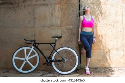 Young Asian Woman With A Bike.