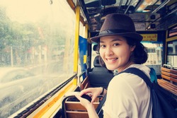 Young Asian Woman In The Bus With Rainy Day.vintage Style