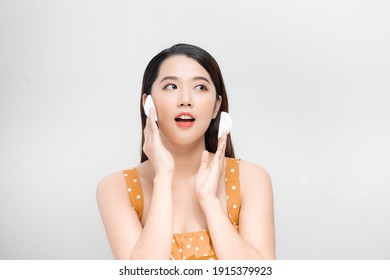 Young Asian Woman Cleaning Beauty Face, Using Cotton Pads, Cleansing Lotion And Facial Toner For Removing Makeup.