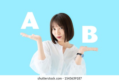 Young Asian Woman Comparing A And B.