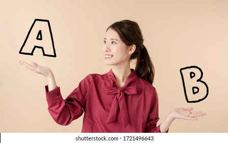 Young Asian Woman Comparing Two Things Stock Photo 1721496643 ...