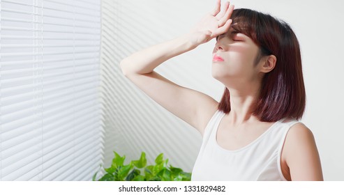 Young asian woman dislike the sunshine because afraid of suntan and oily skin