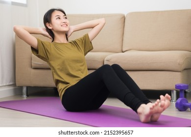 Young Asian Woman Doing Sit Up Workout Exercise On Yoga Mat. Body Weight Training For Health Strength And Powerful. Female Bodybuilder And Muscle Physical At Home. Lifestyle And Healthy Concept.