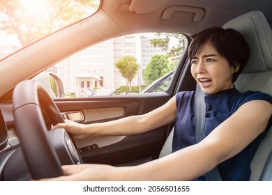 Young Asian Woman Driving A Car. Traffic Accident.