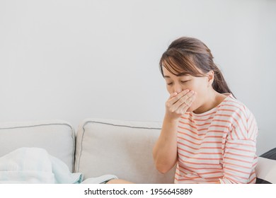 Young Asian Woman Drunk Or Sick Vomiting.woman Have Very Bad Morning Sickness.Pregnant, Pregnancy, Tummy.Woman Suffering From Nausea, Vomit Symptoms.Stomach Infection Due To Food Poisoning.Healthcare.