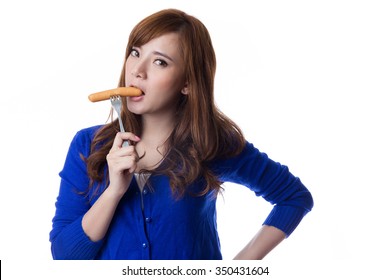 Young Asian Woman Eating Sausage Or Hotdog