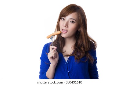 Young Asian Woman Eating Sausage Or Hotdog