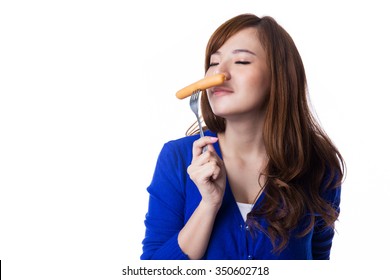 Young Asian Woman Eating Sausage Or Hotdog