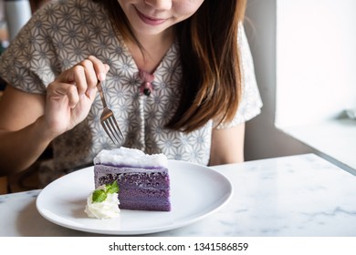 Young Asian Woman Enjoy Eating Dessert In Restaurant