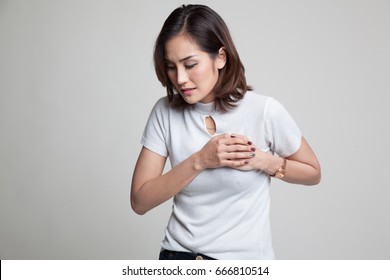 Young Asian Woman Got Chest Pain On Gray Background