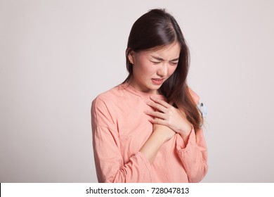 Young Asian Woman Got Chest Pain On Gray Background