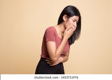Young Asian Woman Got Stomachache About To Vomit On Beige Background