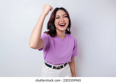 A Young Asian Woman With A Happy Successful Expression Wearing Lilac Purple Shirt Isolated By White Background