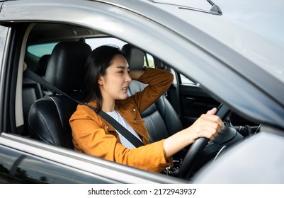 Young Asian Woman Has Broken Down Car On The Road She Feeling Serious And Stressed.Look For Someone Help. Driving During Rush Hour But The Traffic Is Very Congested. Shocked Face