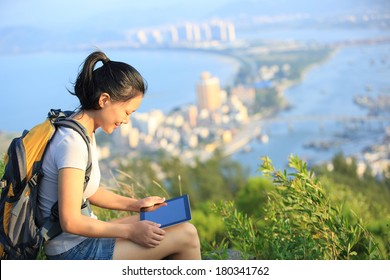 Young Asian Woman Hiker Use Digital Tablet Seaside Mountain Peak 