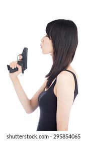 Young Asian Woman Holding A Hand Gun Isolated On White Background