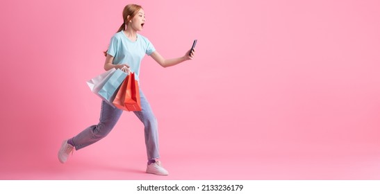 Young Asian Woman Holding Shopping Bag On Pink Background