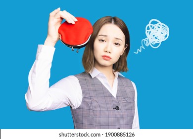 Young asian woman holding a wallet. Trouble of monay. - Shutterstock ID 1900885126